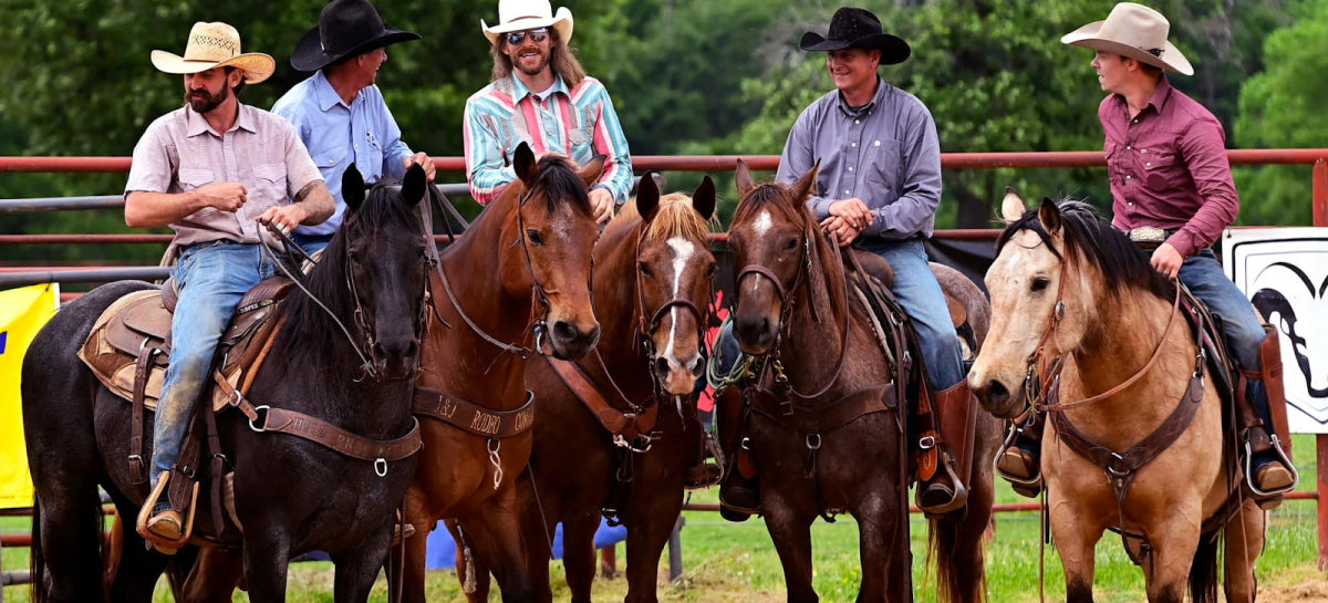 Dale Brisby and a group of cowboys on horses