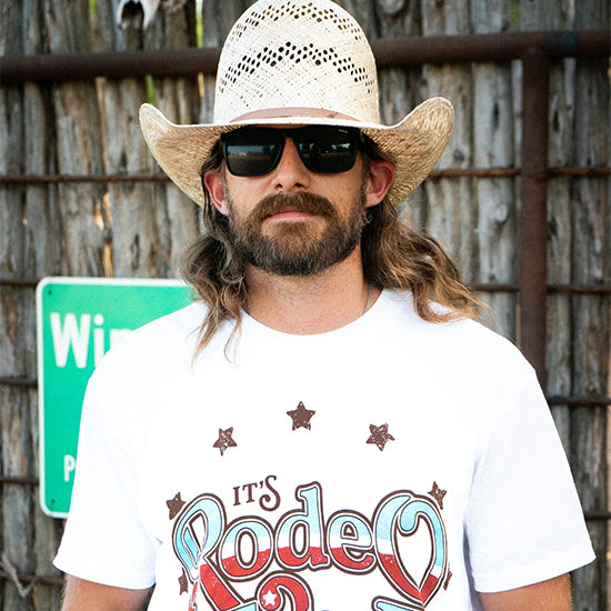 Dale Brisby wearing sunglasses and a cowboy hat